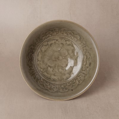 Lot 464 - A Chinese Yaozhou celadon 'peony' bowl, Northern Song dynasty