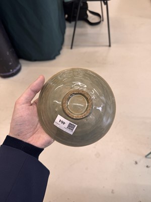 Lot 464 - A Chinese Yaozhou celadon 'peony' bowl, Northern Song dynasty