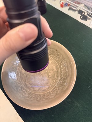 Lot 464 - A Chinese Yaozhou celadon 'peony' bowl, Northern Song dynasty