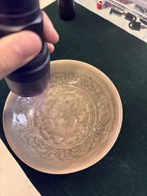 Lot 464 - A Chinese Yaozhou celadon 'peony' bowl, Northern Song dynasty