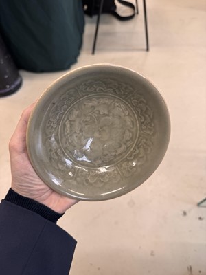 Lot 464 - A Chinese Yaozhou celadon 'peony' bowl, Northern Song dynasty
