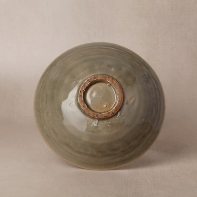 Lot 464 - A Chinese Yaozhou celadon 'peony' bowl, Northern Song dynasty