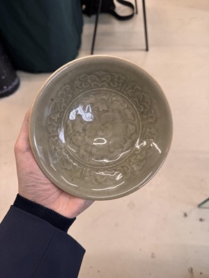 Lot 464 - A Chinese Yaozhou celadon 'peony' bowl, Northern Song dynasty