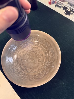Lot 464 - A Chinese Yaozhou celadon 'peony' bowl, Northern Song dynasty