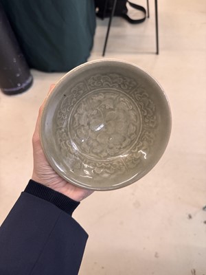 Lot 464 - A Chinese Yaozhou celadon 'peony' bowl, Northern Song dynasty