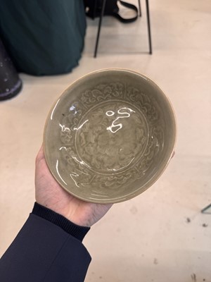 Lot 464 - A Chinese Yaozhou celadon 'peony' bowl, Northern Song dynasty