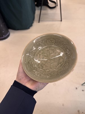 Lot 464 - A Chinese Yaozhou celadon 'peony' bowl, Northern Song dynasty