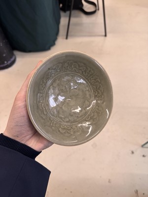 Lot 464 - A Chinese Yaozhou celadon 'peony' bowl, Northern Song dynasty
