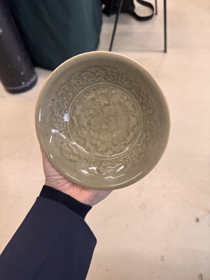 Lot 464 - A Chinese Yaozhou celadon 'peony' bowl, Northern Song dynasty