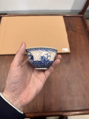 Lot 19 - A Chinese reticulated blue and white 'linglong' bowl, Qing dynasty, Ming dynasty, Chongzhen period