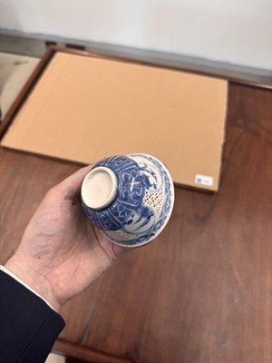 Lot 19 - A Chinese reticulated blue and white 'linglong' bowl, Qing dynasty, Ming dynasty, Chongzhen period