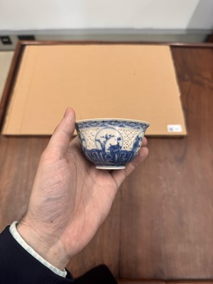 Lot 19 - A Chinese reticulated blue and white 'linglong' bowl, Qing dynasty, Ming dynasty, Chongzhen period