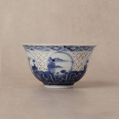 Lot 19 - A Chinese reticulated blue and white 'linglong' bowl, Qing dynasty, Ming dynasty, Chongzhen period