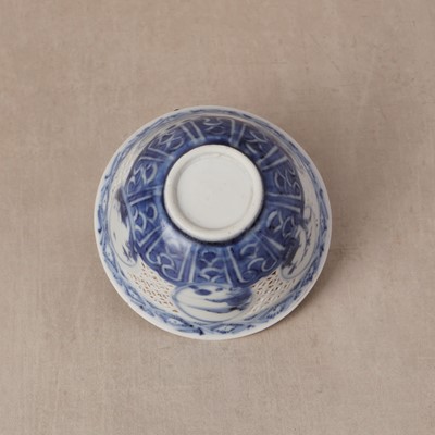 Lot 19 - A Chinese reticulated blue and white 'linglong' bowl, Qing dynasty, Ming dynasty, Chongzhen period