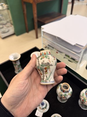 Lot 39 - A Chinese wucai 'squirrel and grapes' miniature garniture set, Transitional period