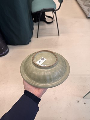 Lot 461 - A Chinese Longquan celadon 'twin fish' moulded dish, Song dynasty