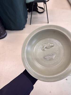 Lot 461 - A Chinese Longquan celadon 'twin fish' moulded dish, Song dynasty