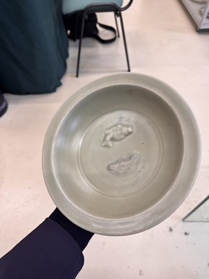 Lot 461 - A Chinese Longquan celadon 'twin fish' moulded dish, Song dynasty