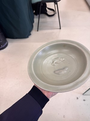 Lot 461 - A Chinese Longquan celadon 'twin fish' moulded dish, Song dynasty