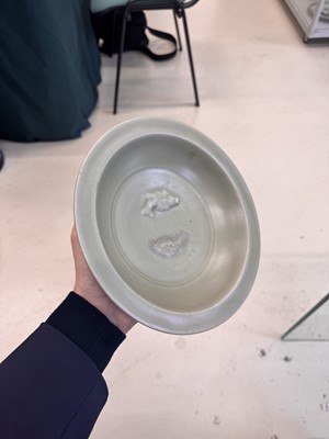 Lot 461 - A Chinese Longquan celadon 'twin fish' moulded dish, Song dynasty