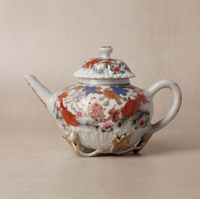 Lot 156 - A Chinese export famille-rose 'fish pond' teapot, Qing dynasty, Yongzheng period