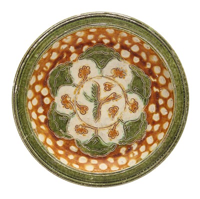 Lot 248 - A Chinese sancai-glazed 'goose and lotus' dish, Tang dynasty