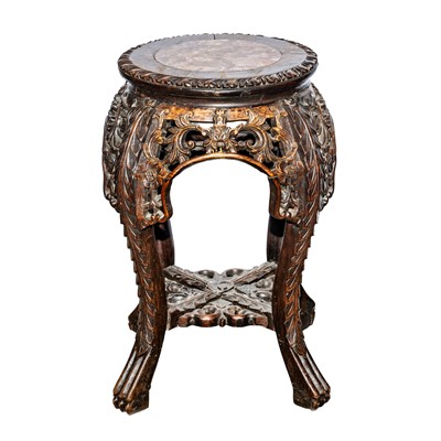 Lot 395 - A Chinese carved hardwood jardinière stand