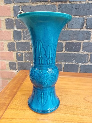 Lot 74 - A Chinese monochrome turquoise-glazed incised 'gu' vase, Qing dynasty, 18th century