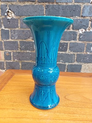 Lot 74 - A Chinese monochrome turquoise-glazed incised 'gu' vase, Qing dynasty, 18th century