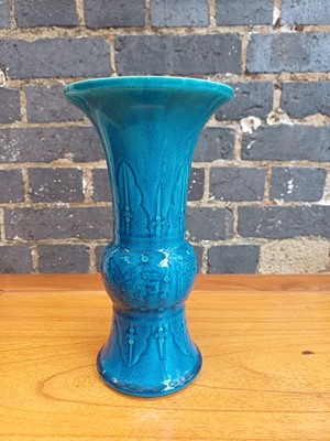Lot 74 - A Chinese monochrome turquoise-glazed incised 'gu' vase, Qing dynasty, 18th century