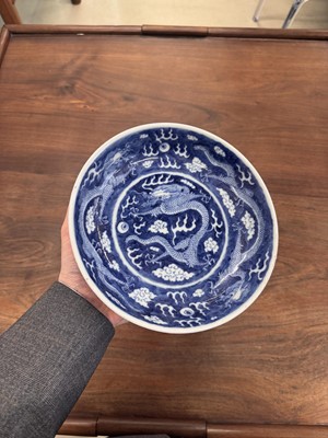 Lot 62 - A Chinese blue and white 'dragon' dish, Qing dynasty, Guangxu mark and of the period