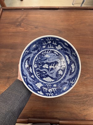 Lot 62 - A Chinese blue and white 'dragon' dish, Qing dynasty, Guangxu mark and of the period