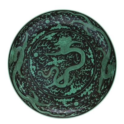 Lot 769 - A Chinese black-ground green-glazed 'dragons' dish, 20th century, Guangxu mark