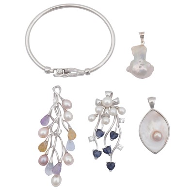 Lot 214 - A bangle and four pendants