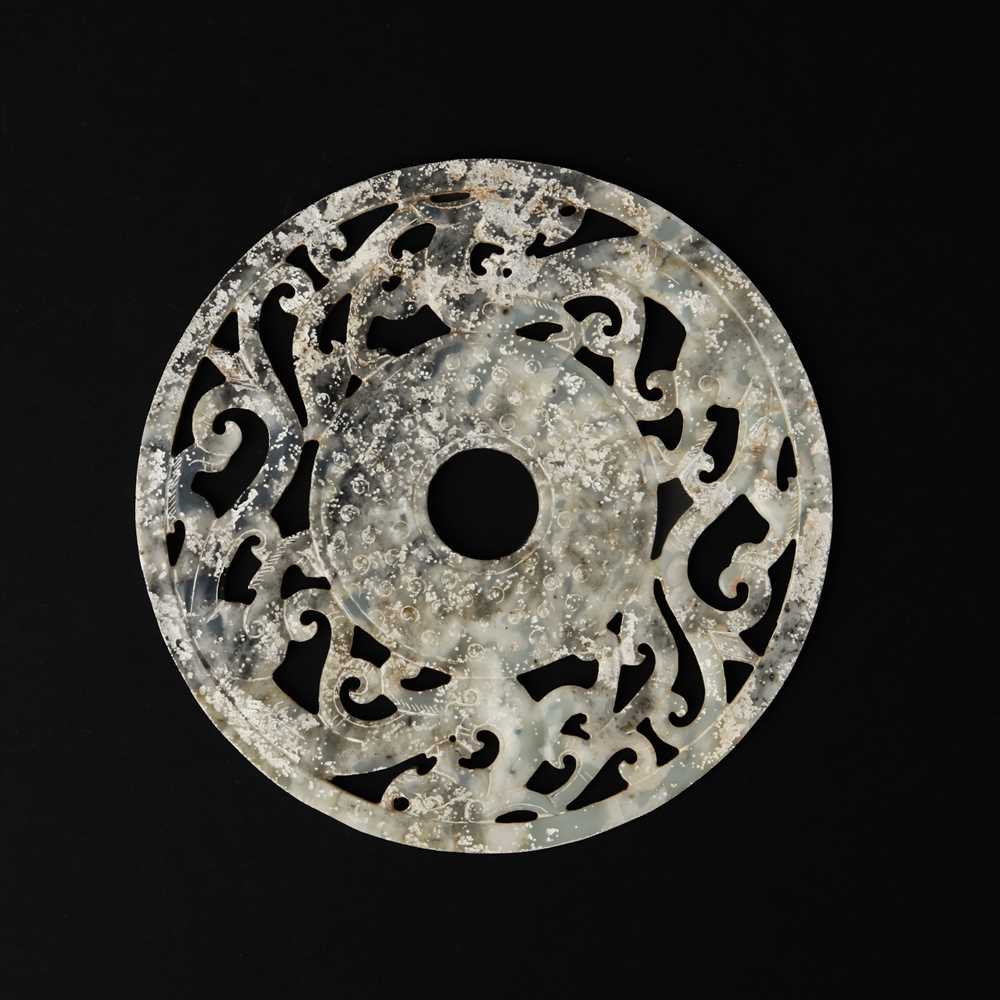 Lot 114 - A large Chinese jade 'chilong' bi disc, Han dynasty or later