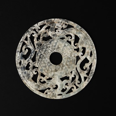 Lot 114 - A large Chinese jade 'chilong' bi disc, Han dynasty or later