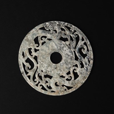Lot 114 - A large Chinese jade 'chilong' bi disc, Han dynasty or later