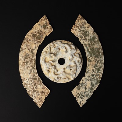 Lot 121 - Three Chinese archaistic 'mythical beast' jade plaques, 19th/20th century or earlier