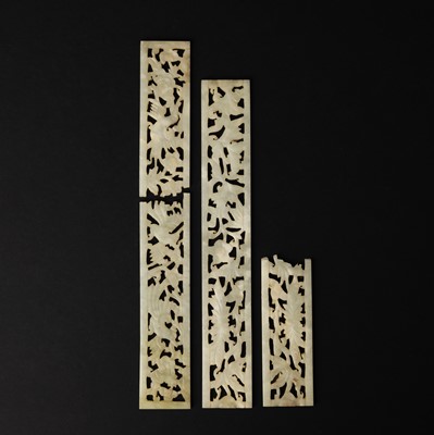 Lot 123 - Three Chinese reticulated jade 'birds and flowers' plaques, Ming/Yuan dynasty