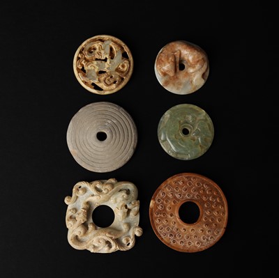 Lot 118 - Six Chinese carved jade round plaques, 18th/19th century or earlier