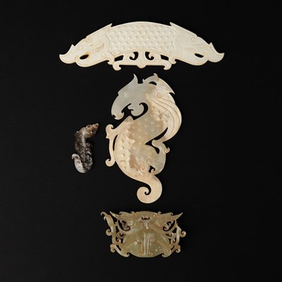 Lot 115 - Four Chinese archaistic jade pendants, 19th/20th century or earlier