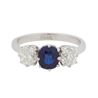 Lot 73 - A sapphire and diamond three-stone ring