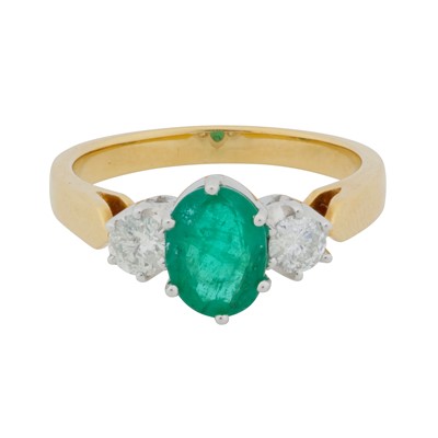Lot 243 - An emerald and diamond three-stone ring