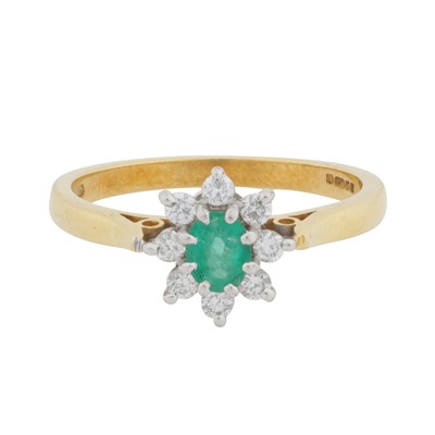 Lot 463 - An emerald and diamond cluster ring, circa 2001
