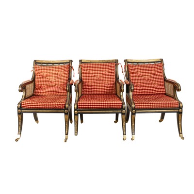 Lot 231 - A group of Regency style ebonized and parcel-gilt armchairs