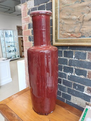 Lot 37 - A rare and very large Chinese copper red-glazed 'Langyao' rouleau vase, Qing dynasty, Kangxi period