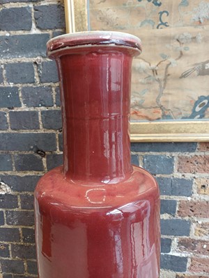 Lot 37 - A rare and very large Chinese copper red-glazed 'Langyao' rouleau vase, Qing dynasty, Kangxi period