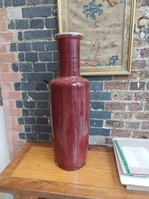 Lot 37 - A rare and very large Chinese copper red-glazed 'Langyao' rouleau vase, Qing dynasty, Kangxi period