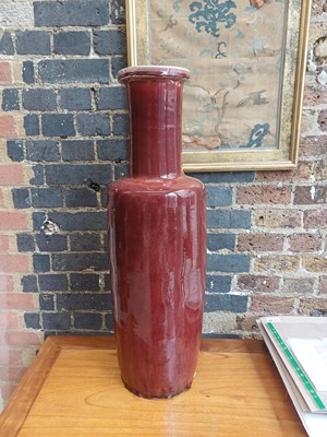 Lot 37 - A rare and very large Chinese copper red-glazed 'Langyao' rouleau vase, Qing dynasty, Kangxi period