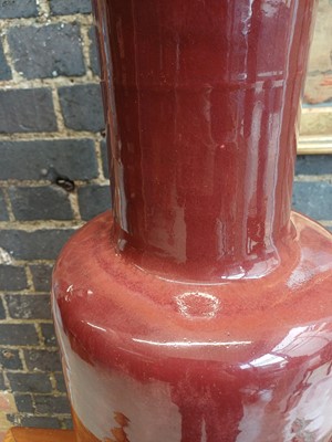 Lot 37 - A rare and very large Chinese copper red-glazed 'Langyao' rouleau vase, Qing dynasty, Kangxi period
